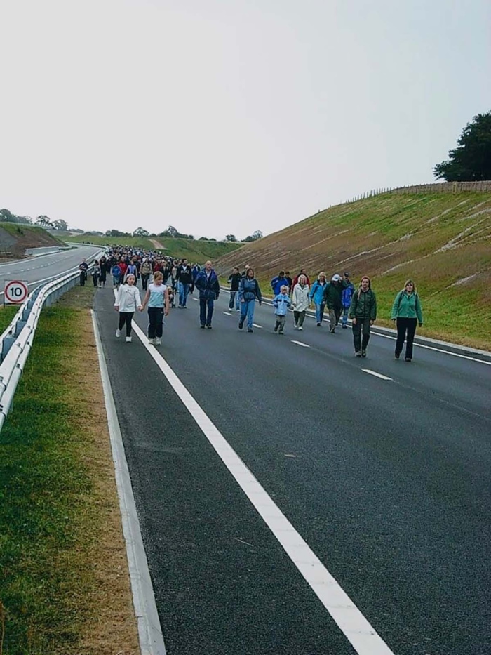 Completed bypass with villagers walking its length before opening